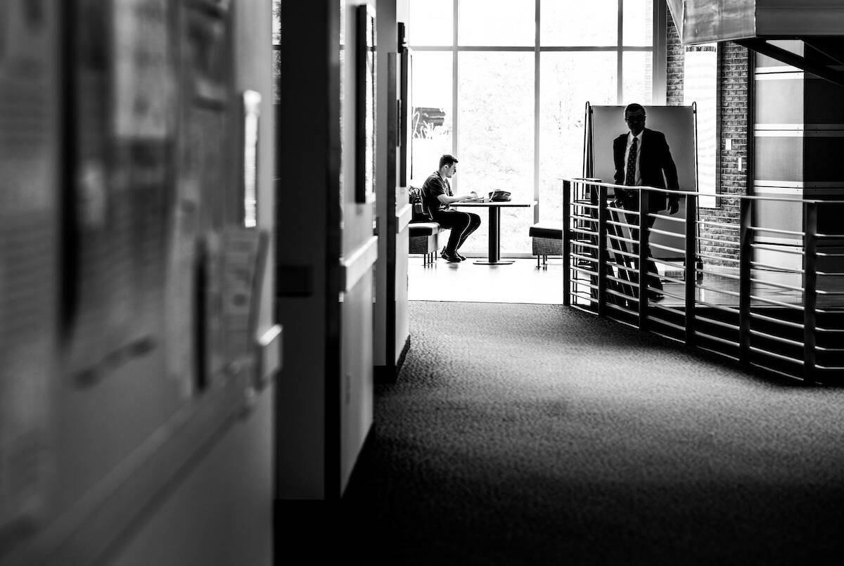 PCE student sitting in front of window